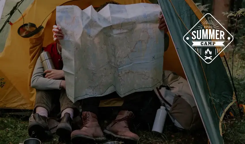 Person holding up a map at camp RPAG