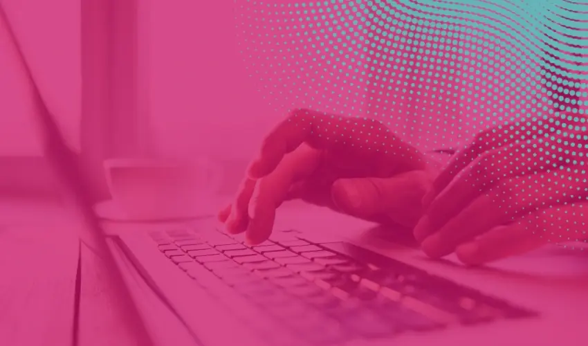Close-up of hands typing on a laptop keyboard, overlaid with a pink and teal halftone pattern.