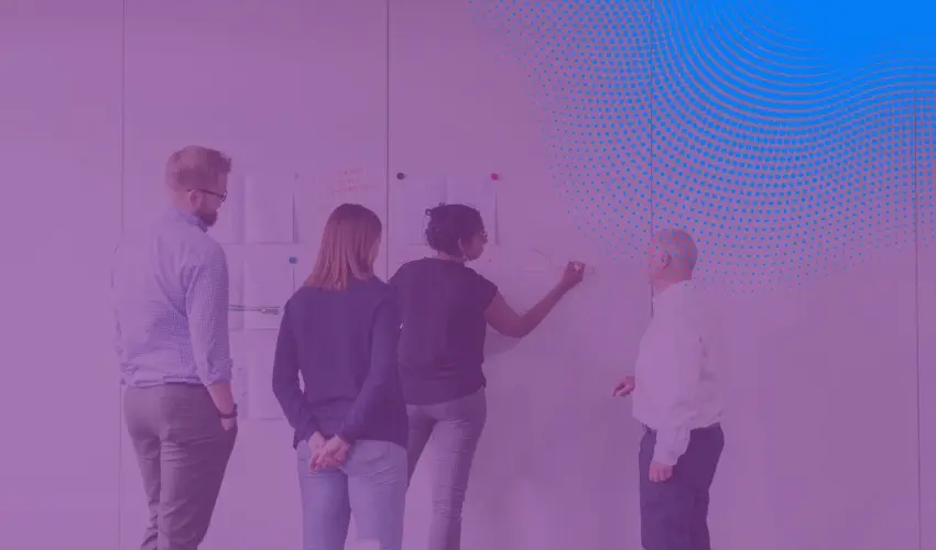 People writing on white board