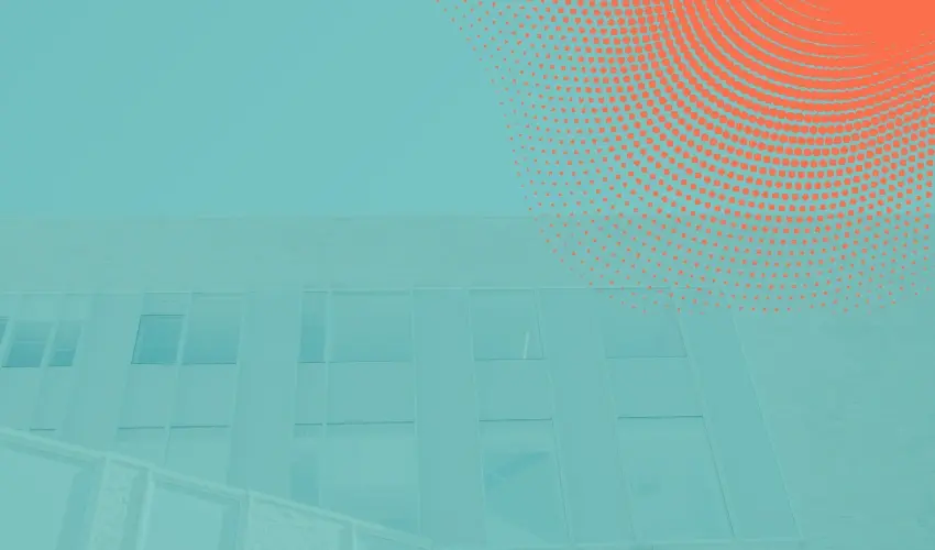 Abstract image of a modern building with large windows, overlaid with a red halftone dot pattern in the upper right corner on a teal background.