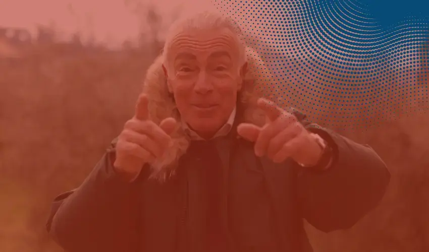 older man pointing at the camera with a red overlay and the blue halftone in the corner