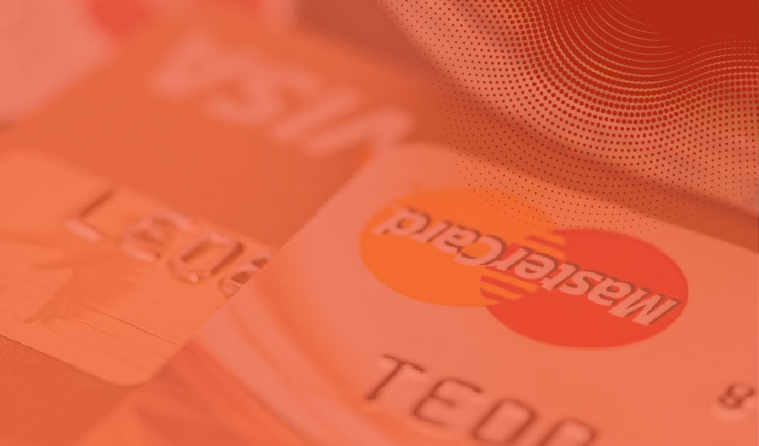 credit cards lying on top of each other with orange overlay